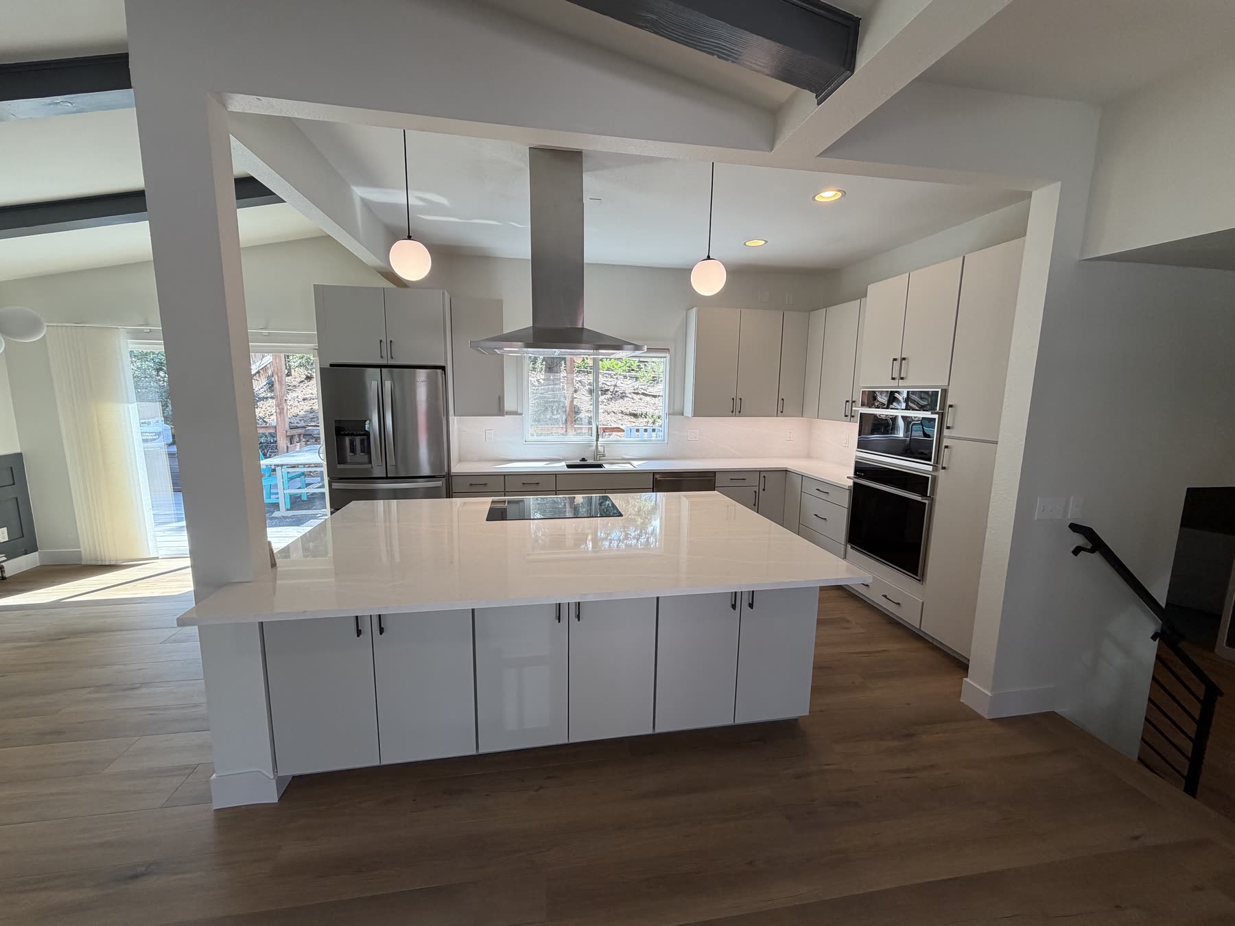 Kitchen remodel with a large island and quartz counters