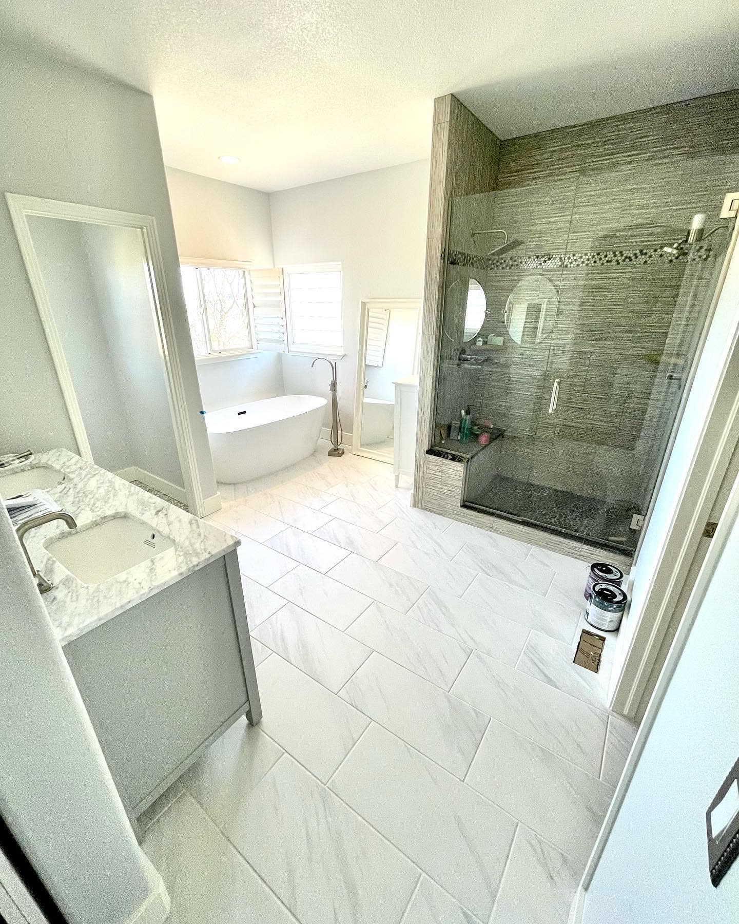 Master bathroom with a freestanding tub and tile shower